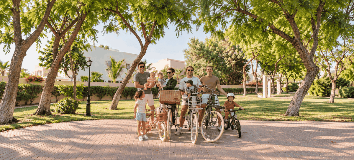 Group of families with Adam bikes in a sunny park in Dubai